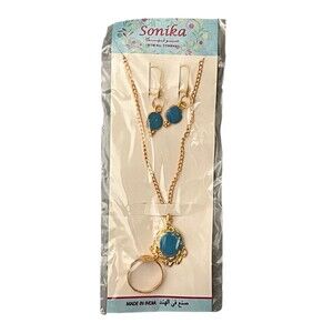 Gold chain necklace, dangle earrings, and ring set